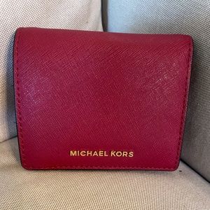 Michael Kors deep red wallet.